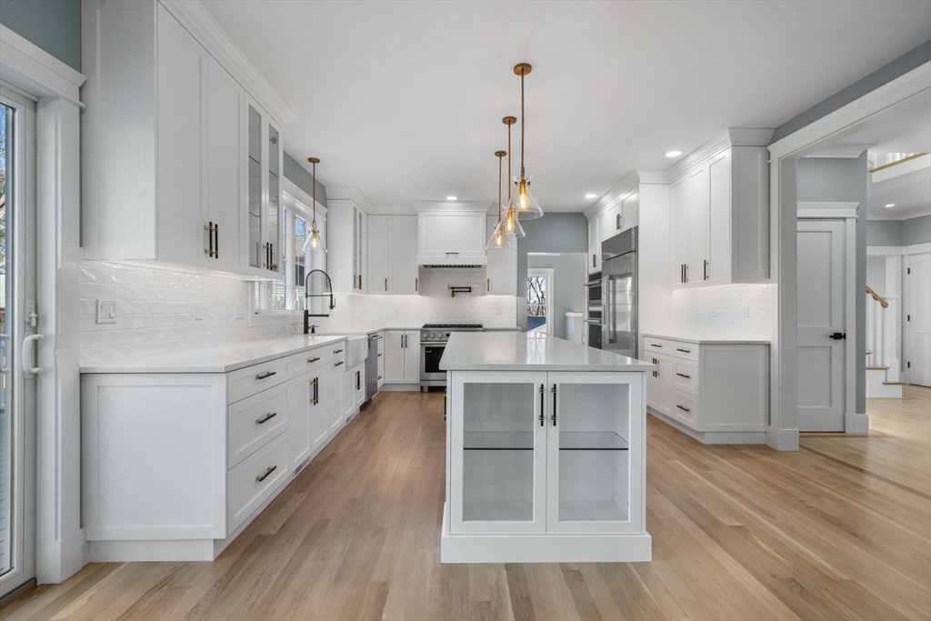 1 A Highland Way Burlington, MA 01803 - Photo 14 of 42 a kitchen with white cabinets and sink