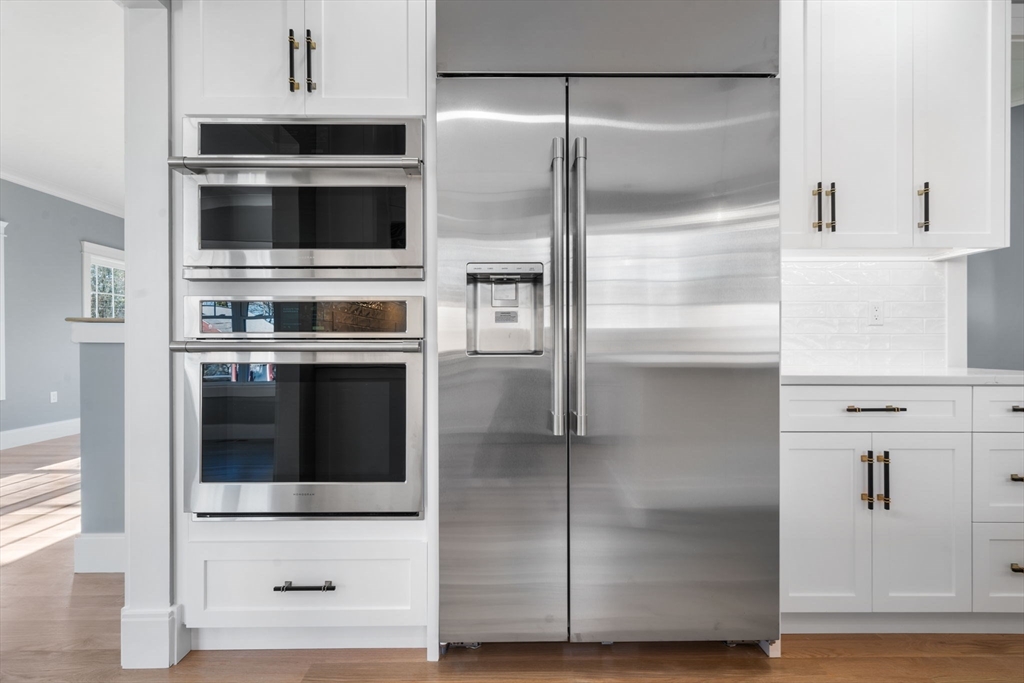 1 A Highland Way Burlington, MA 01803 - Photo 17 of 42 a kitchen with stainless steel appliances kitchen island a refrigerator and a microwave