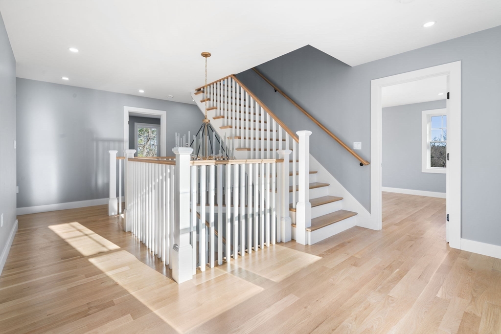 1 A Highland Way Burlington, MA 01803 - Photo 37 of 42 a view of a hallway with entryway with wooden floor