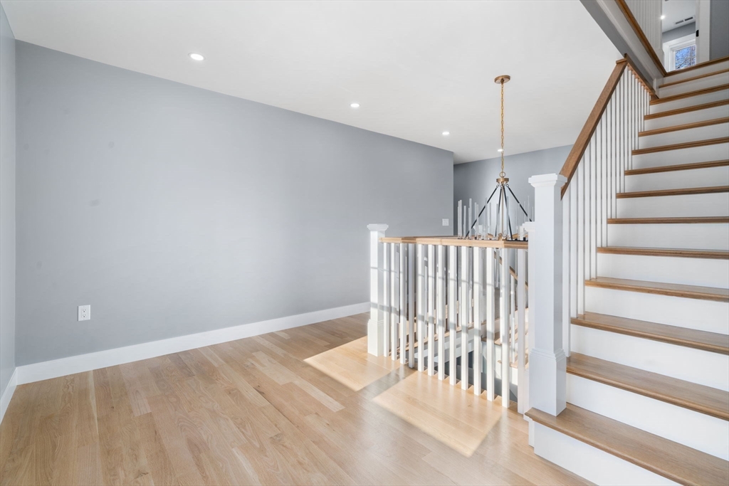 1 A Highland Way Burlington, MA 01803 - Photo 39 of 42 a view of staircase with white walls and railing