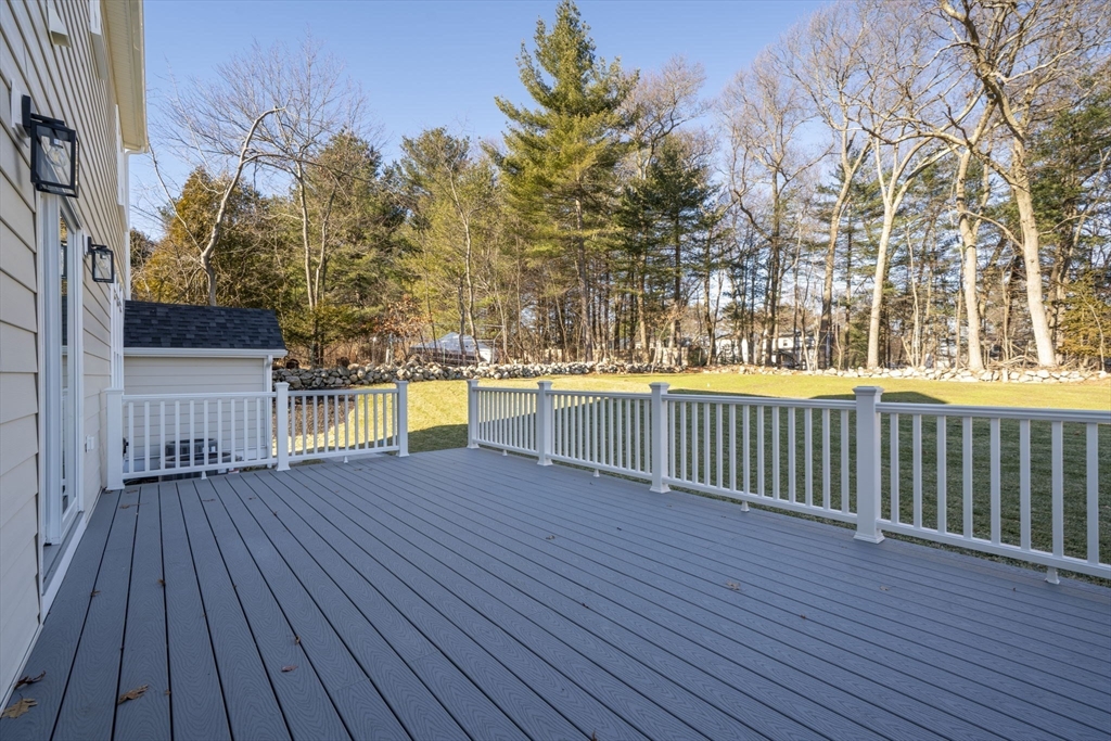 1 A Highland Way Burlington, MA 01803 - Photo 10 of 42 a view of a balcony with wooden floor and fence