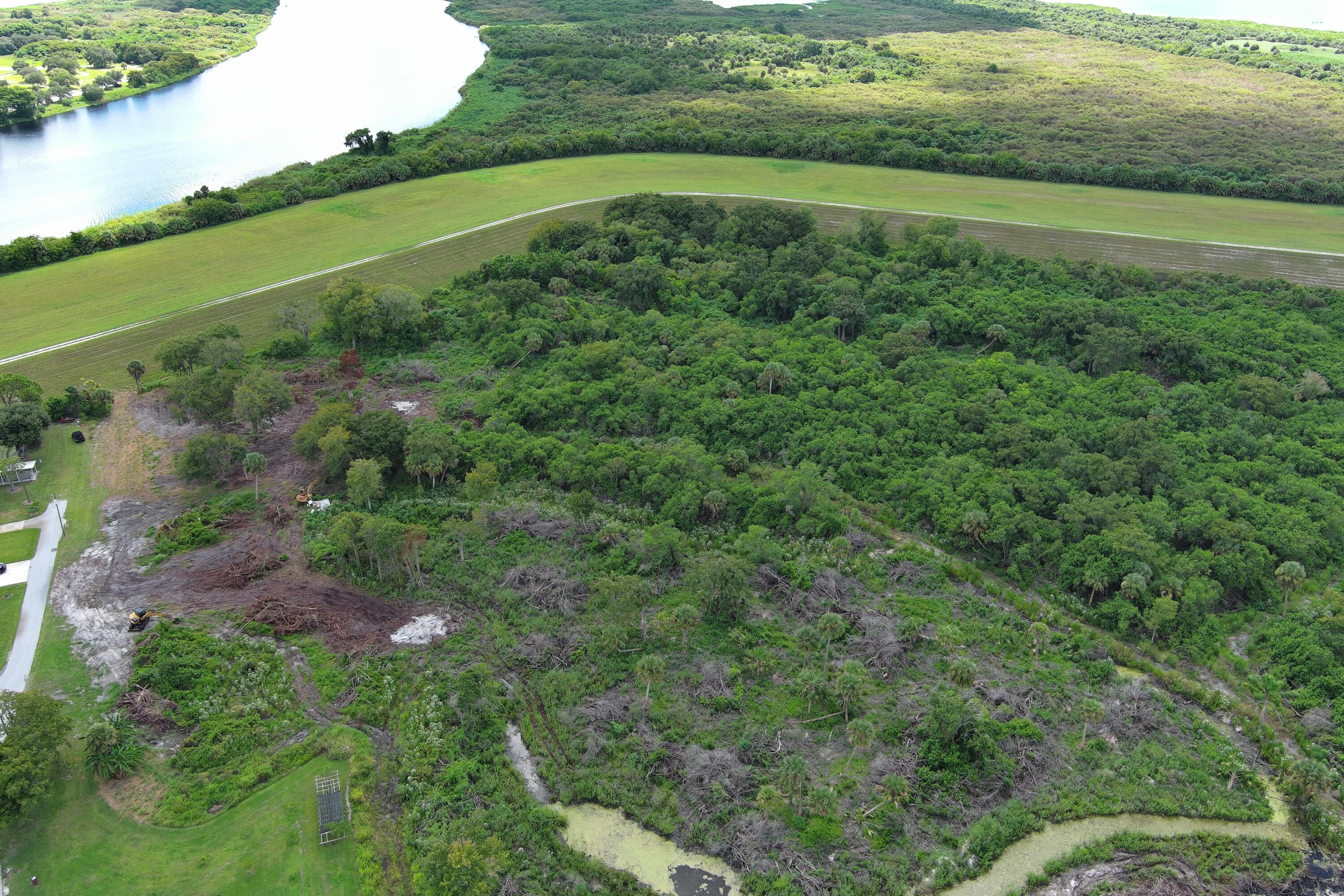 0 Perch Street Okeechobee, FL 34974 - Photo 3 of 25 a view of a green yard with an trees