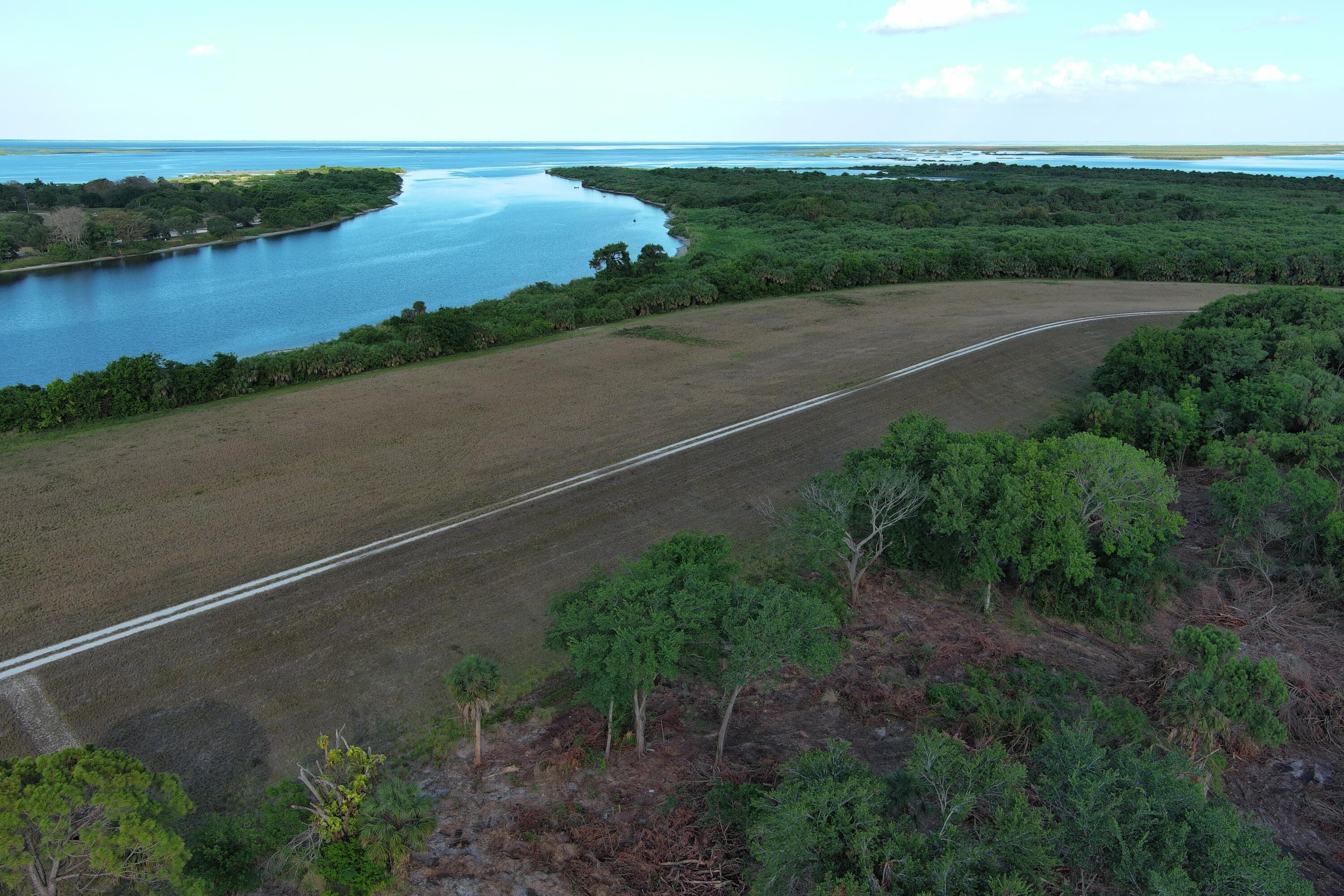 0 Perch Street Okeechobee, FL 34974 - Photo 4 of 25 an aerial view of a houses with yard and ocean view