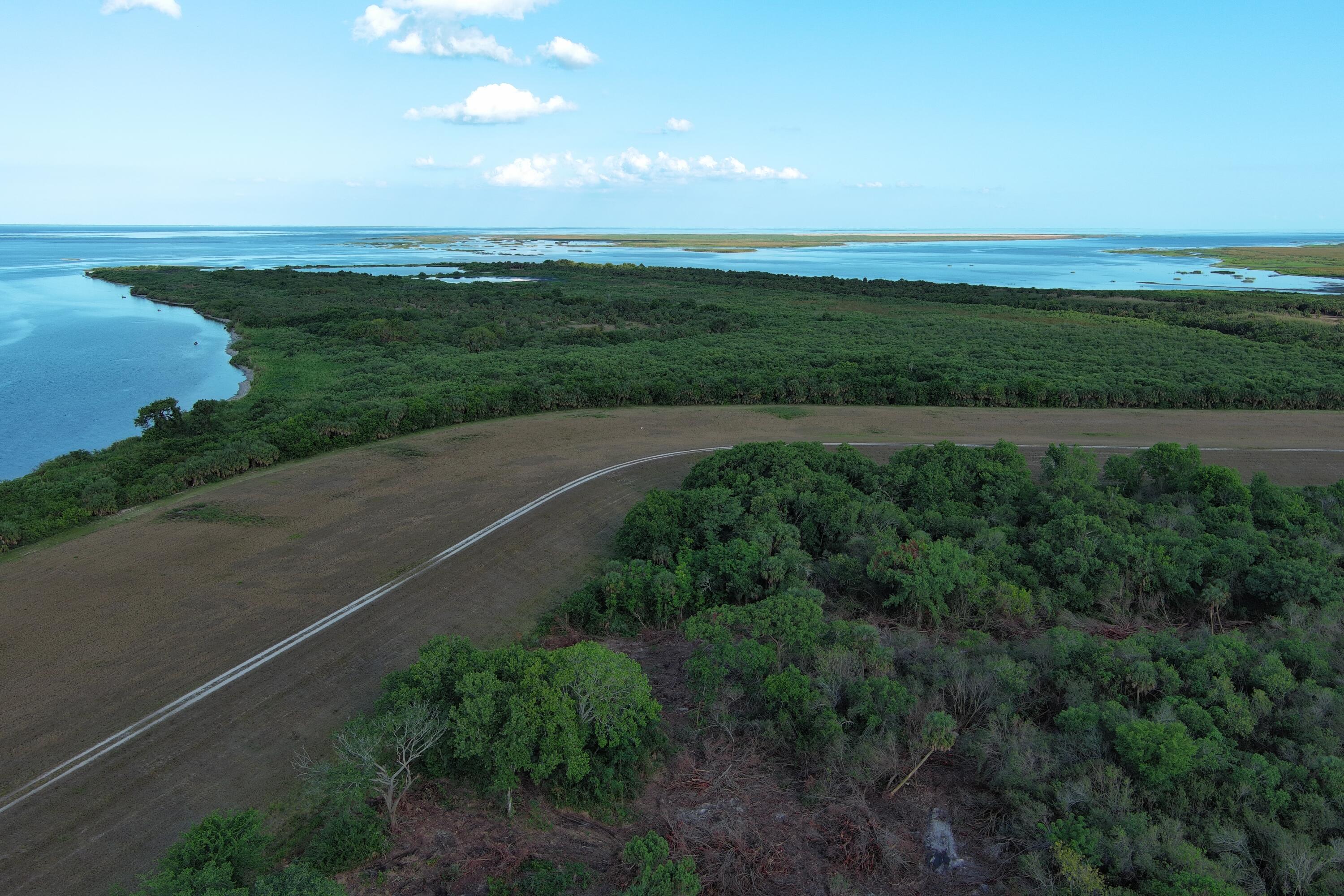 0 Perch Street Okeechobee, FL 34974 - Photo 6 of 25 a view of an ocean and a yard