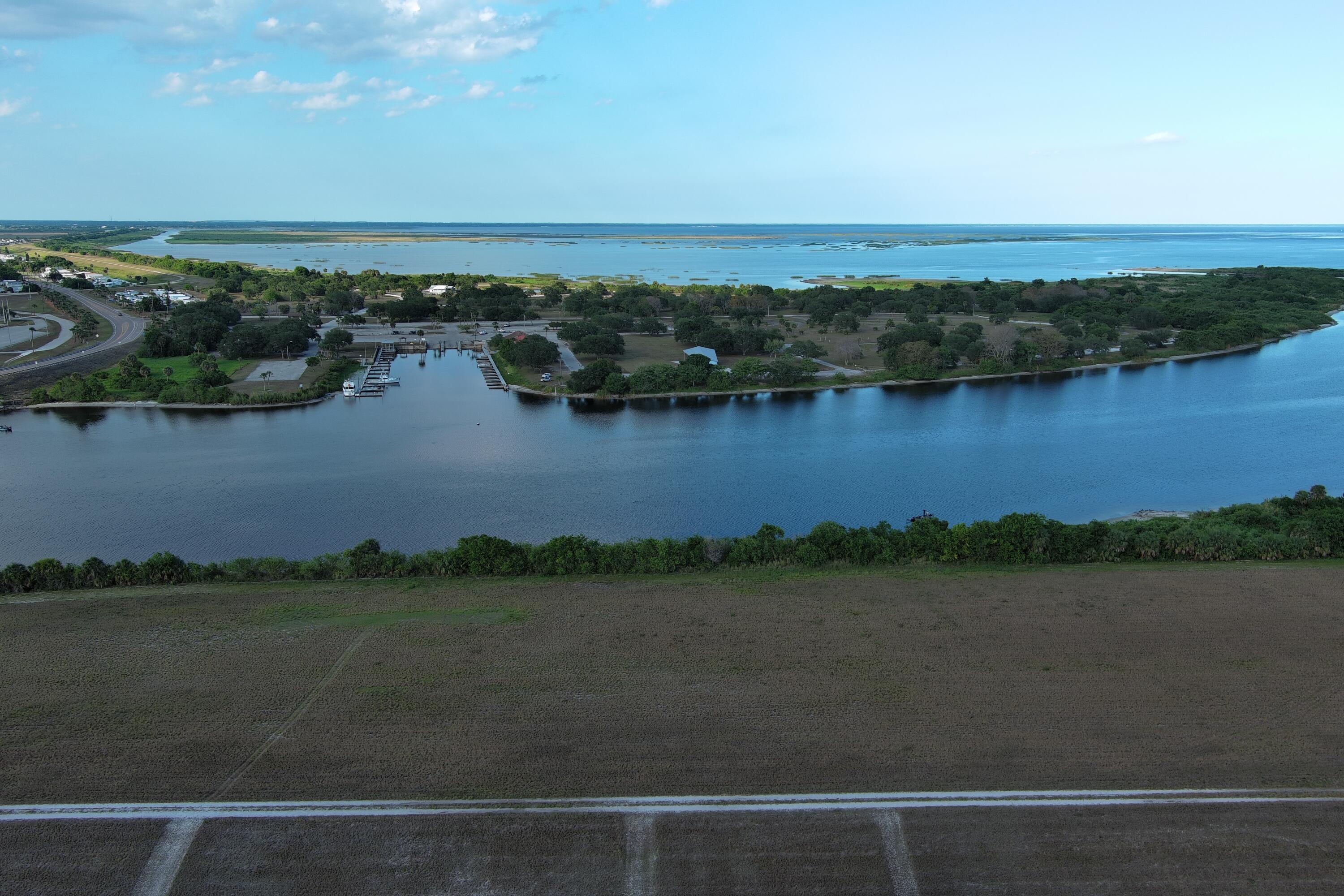 0 Perch Street Okeechobee, FL 34974 - Photo 7 of 25 an aerial view of residential building with outdoor space and lake