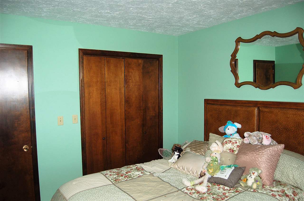 16085 West Hazelview Road Polo, IL 61064 - Photo 11 of 25 a bedroom with a bed table and a lamp