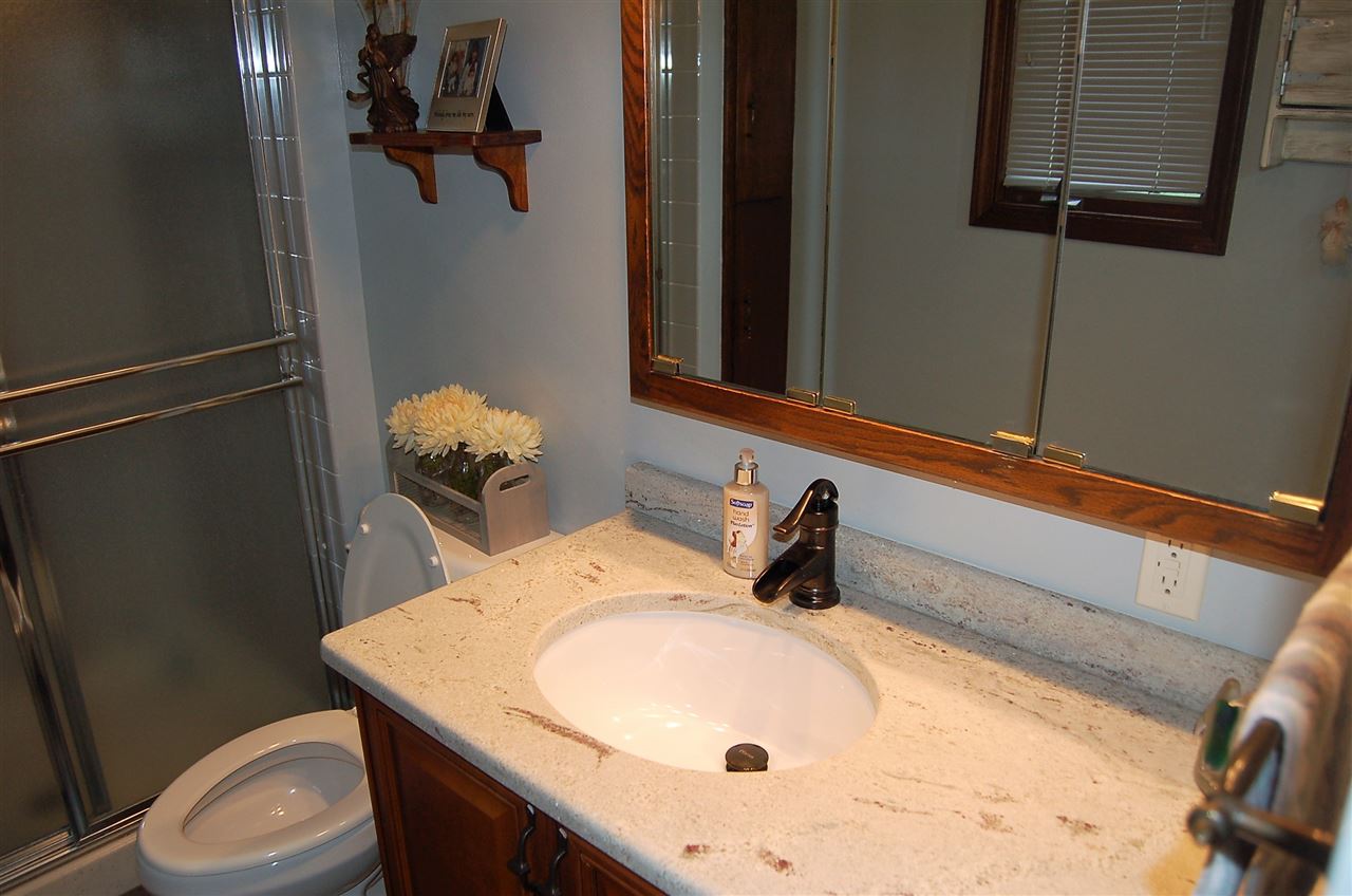 16085 West Hazelview Road Polo, IL 61064 - Photo 13 of 25 a bathroom with a sink and toilet