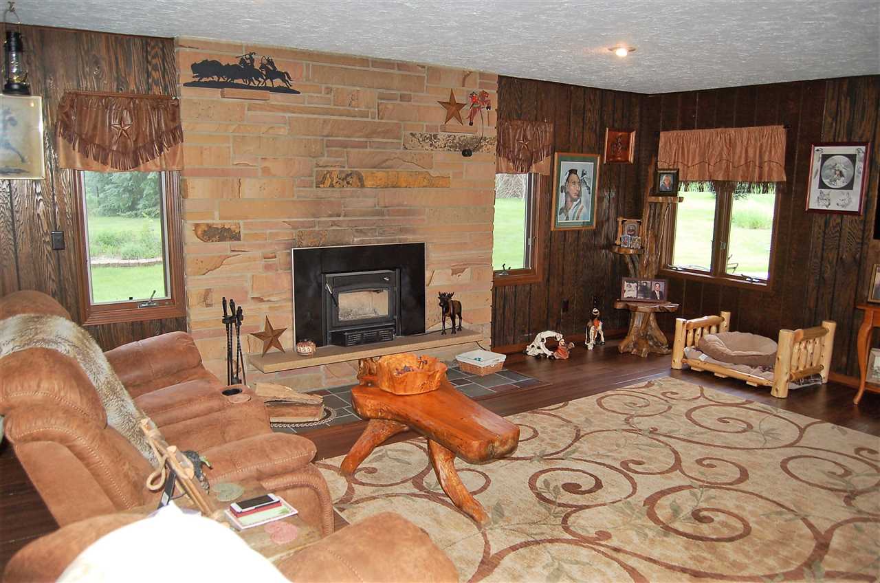 16085 West Hazelview Road Polo, IL 61064 - Photo 8 of 25 a living room with furniture and a fireplace