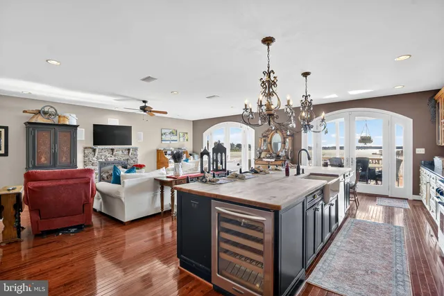 a view of a patio with couches chairs and potted plants