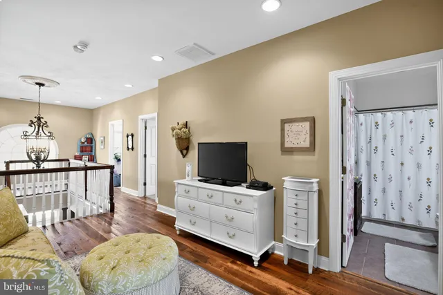 a bedroom with bed and a window