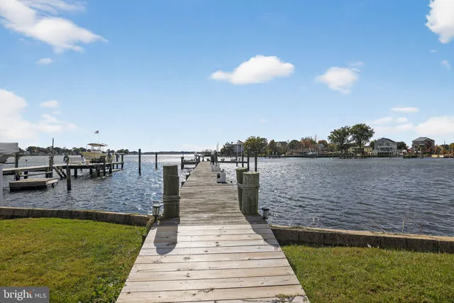 a view of roof deck with two chairs and wooden floor
