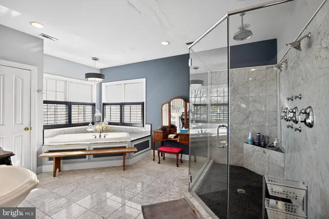 a bathroom with a toilet a sink and a mirror