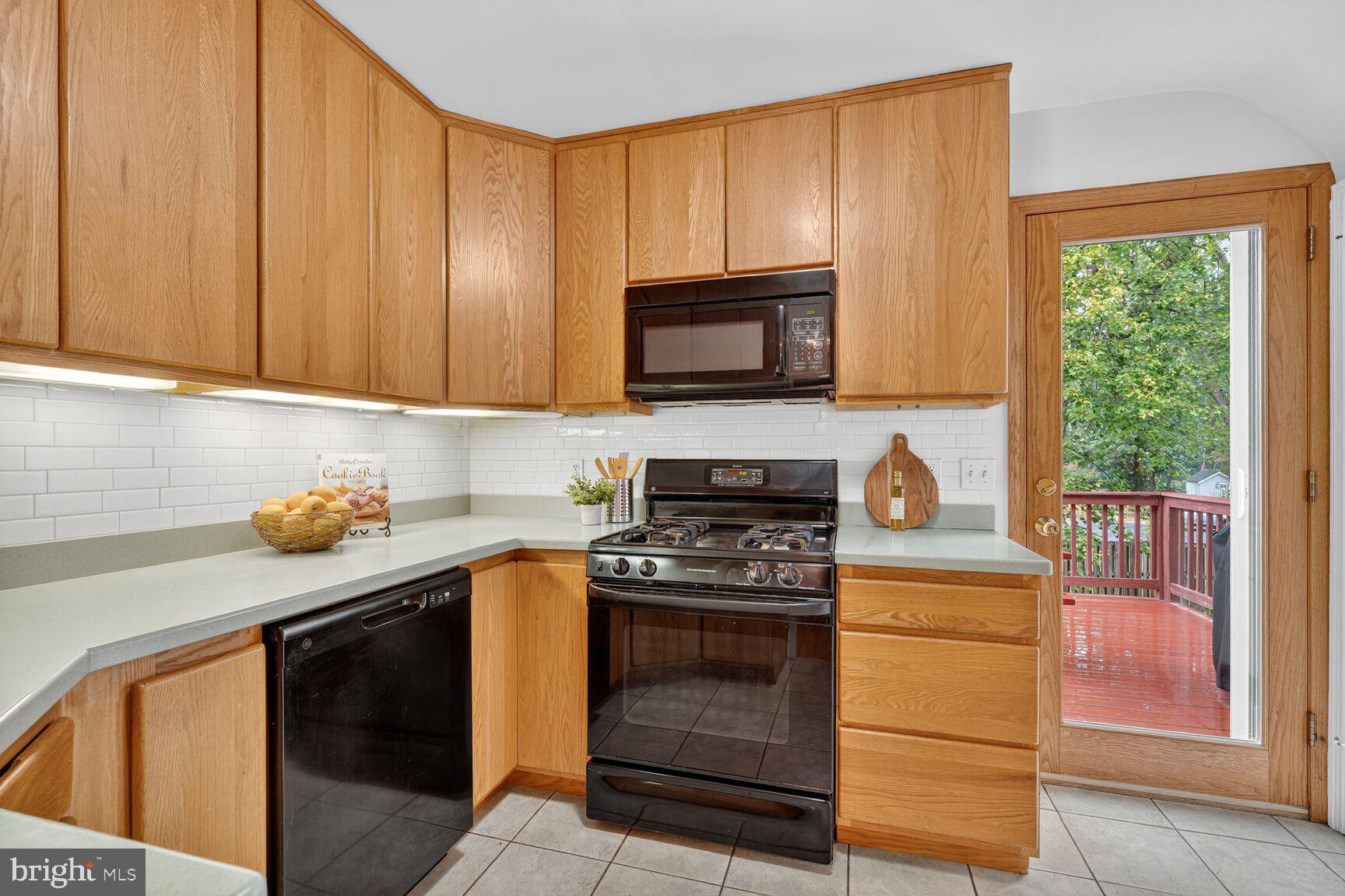 5021 25th Road North Arlington, VA 22207 - Photo 13 of 35 a kitchen with a stove a sink and a microwave