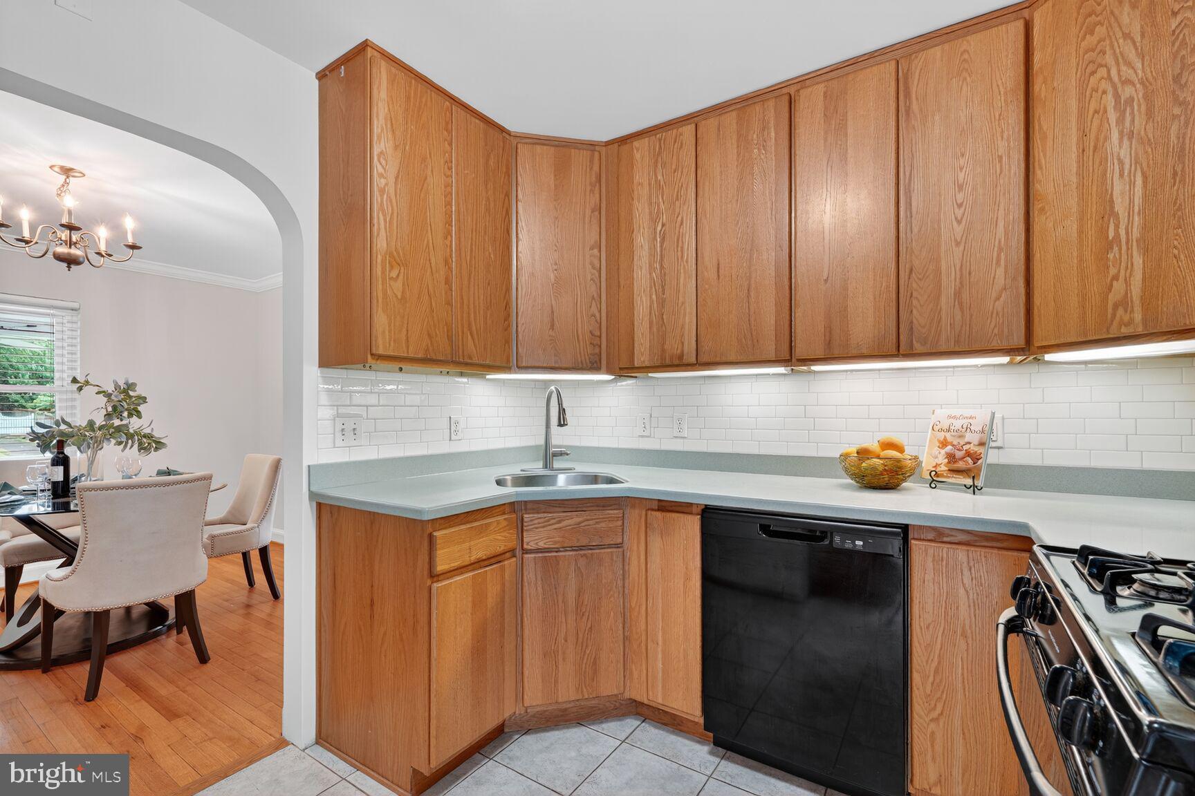 5021 25th Road North Arlington, VA 22207 - Photo 14 of 35 a kitchen with a sink and cabinets