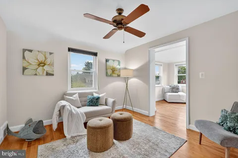 a bedroom with furniture and a large window