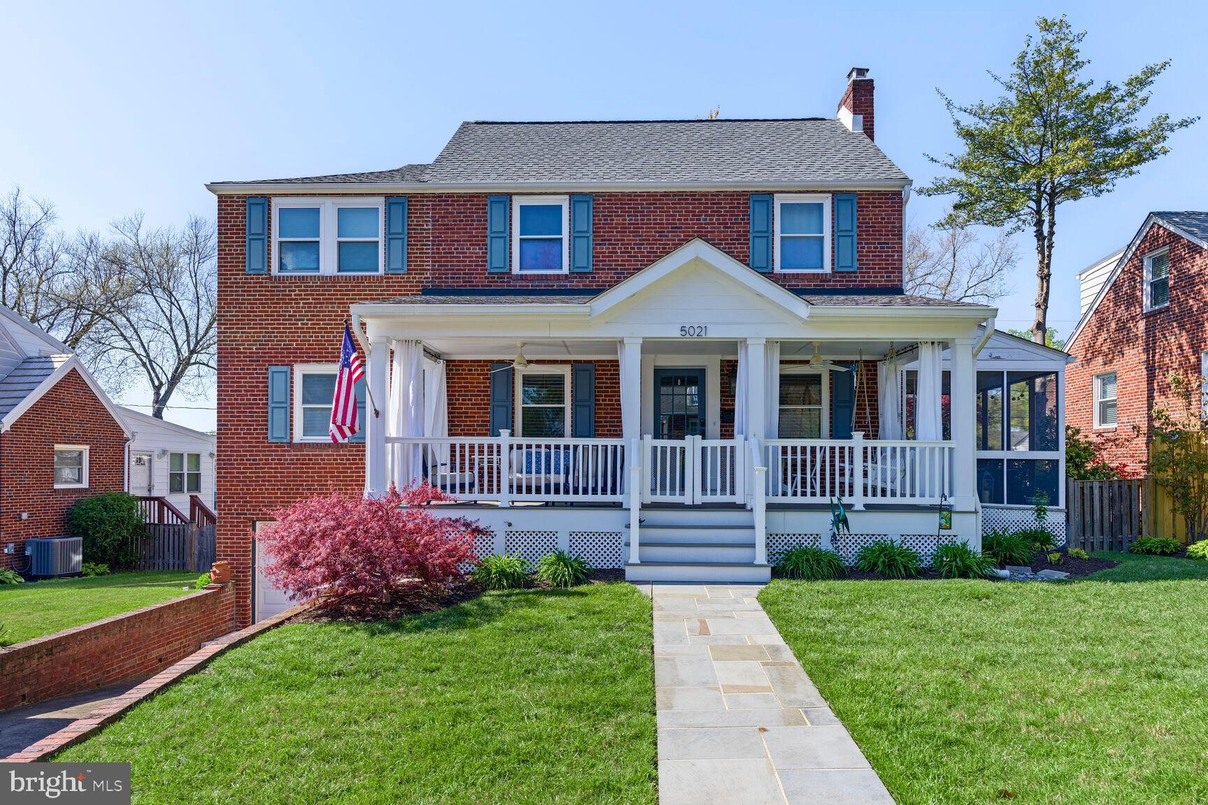 5021 25th Road North Arlington, VA 22207 - Photo 2 of 35 a front view of a house with a yard