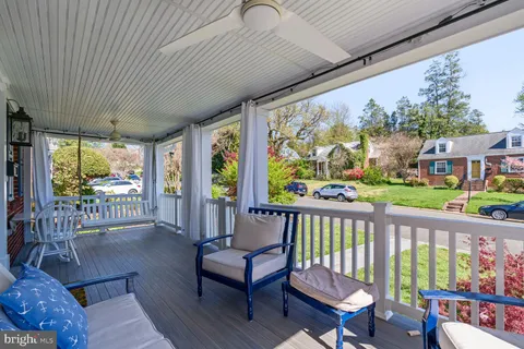 a view of a two chairs in the balcony