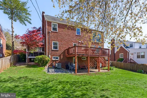 a view of a house with a yard porch and sitting area