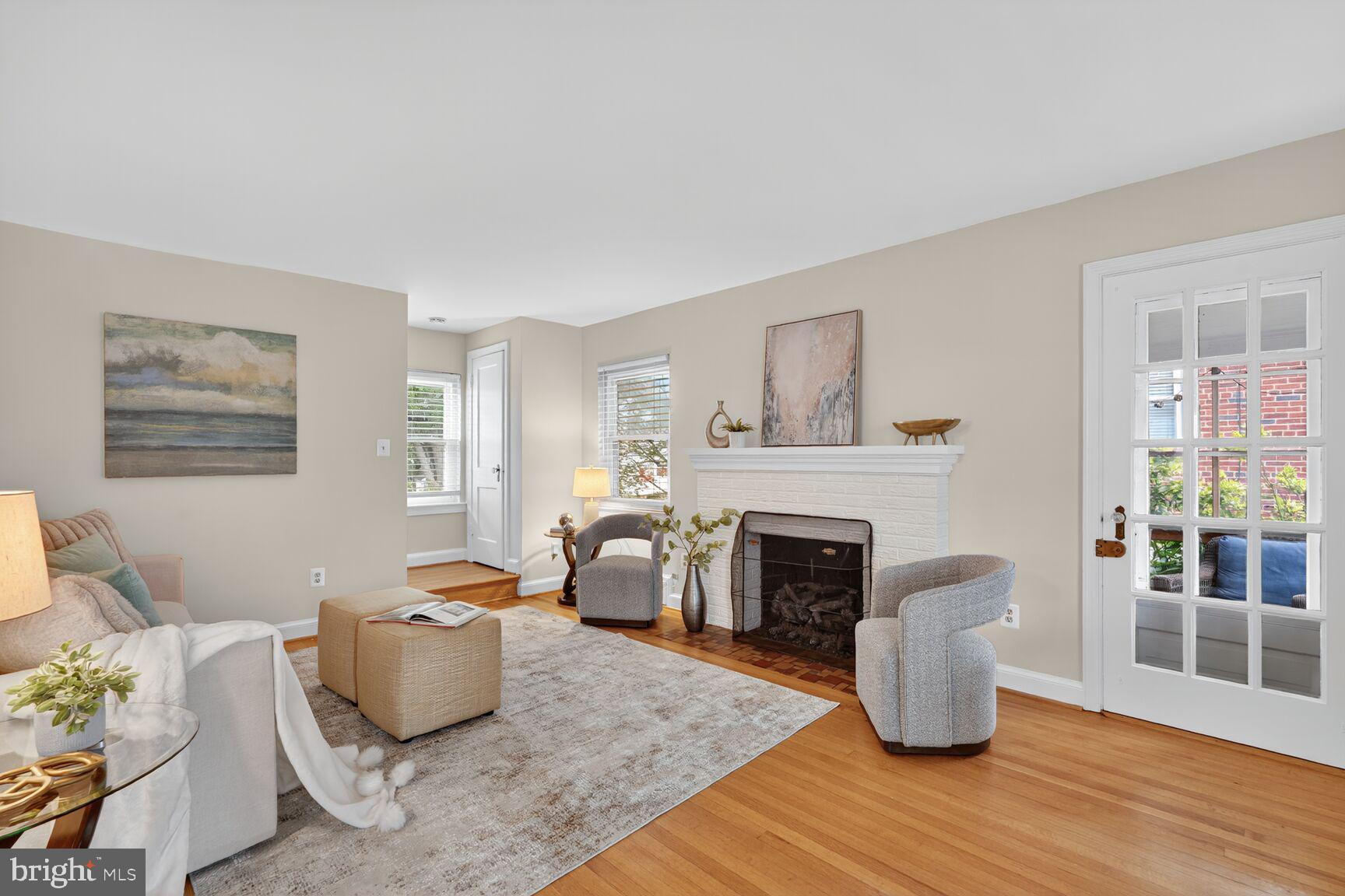 5021 25th Road North Arlington, VA 22207 - Photo 4 of 35 a living room with furniture a fireplace and a table