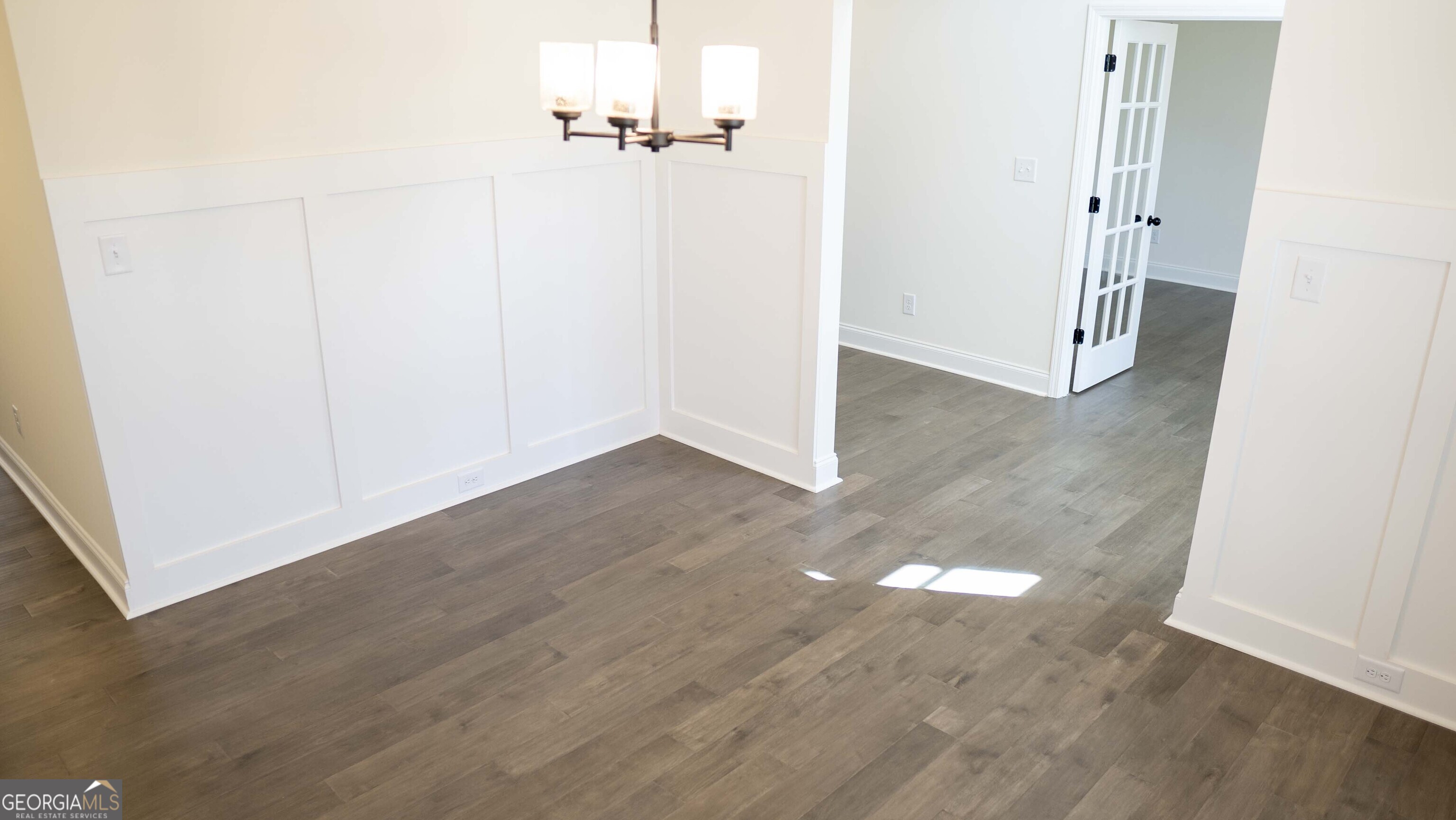 604 Beaver Court Perry, GA 31069 - Photo 9 of 40 an empty room with wooden floor
