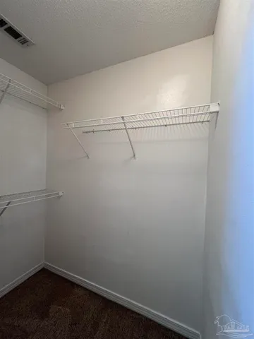 a view of a room with racks on the wall