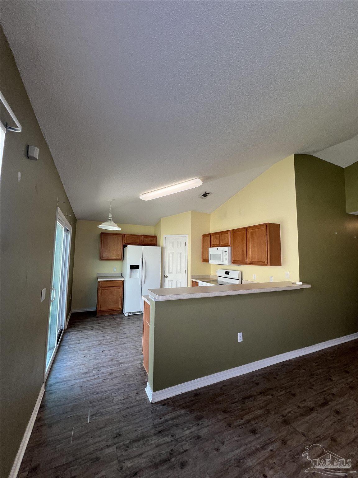 120 Nivana Drive Crestview, FL 32536 - Photo 4 of 20 a view of a room with wooden floor and electronic appliances