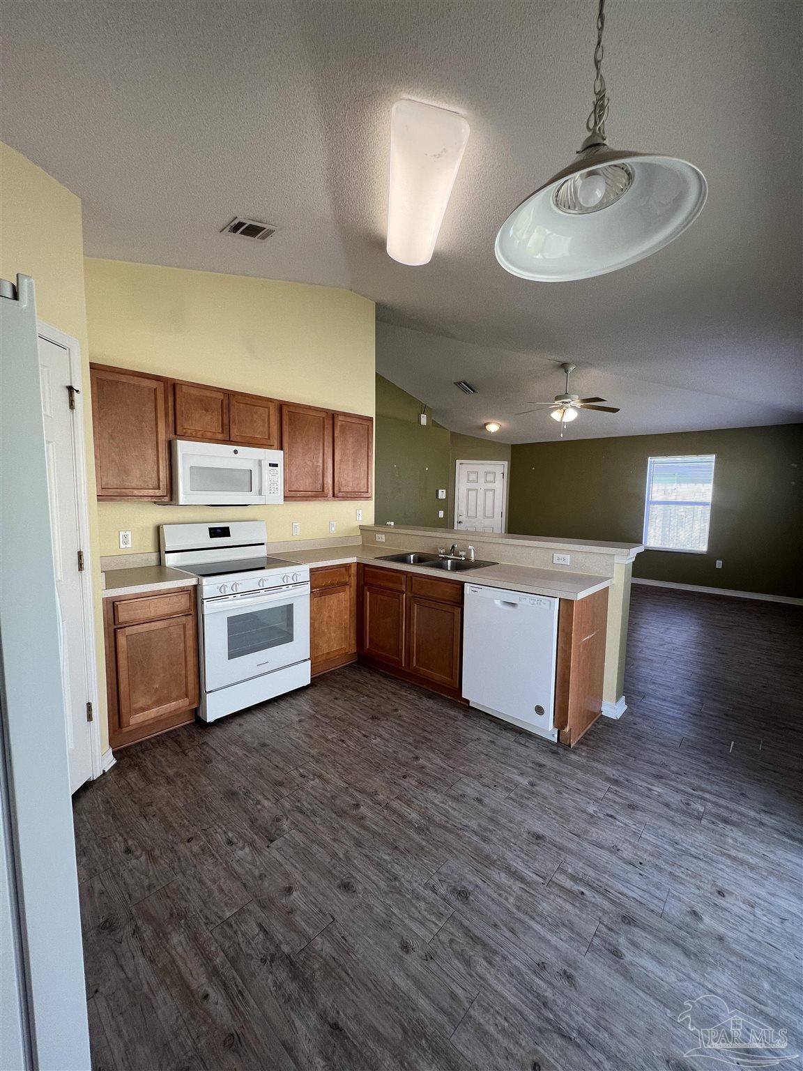 120 Nivana Drive Crestview, FL 32536 - Photo 5 of 20 a kitchen with a stove window and chairs