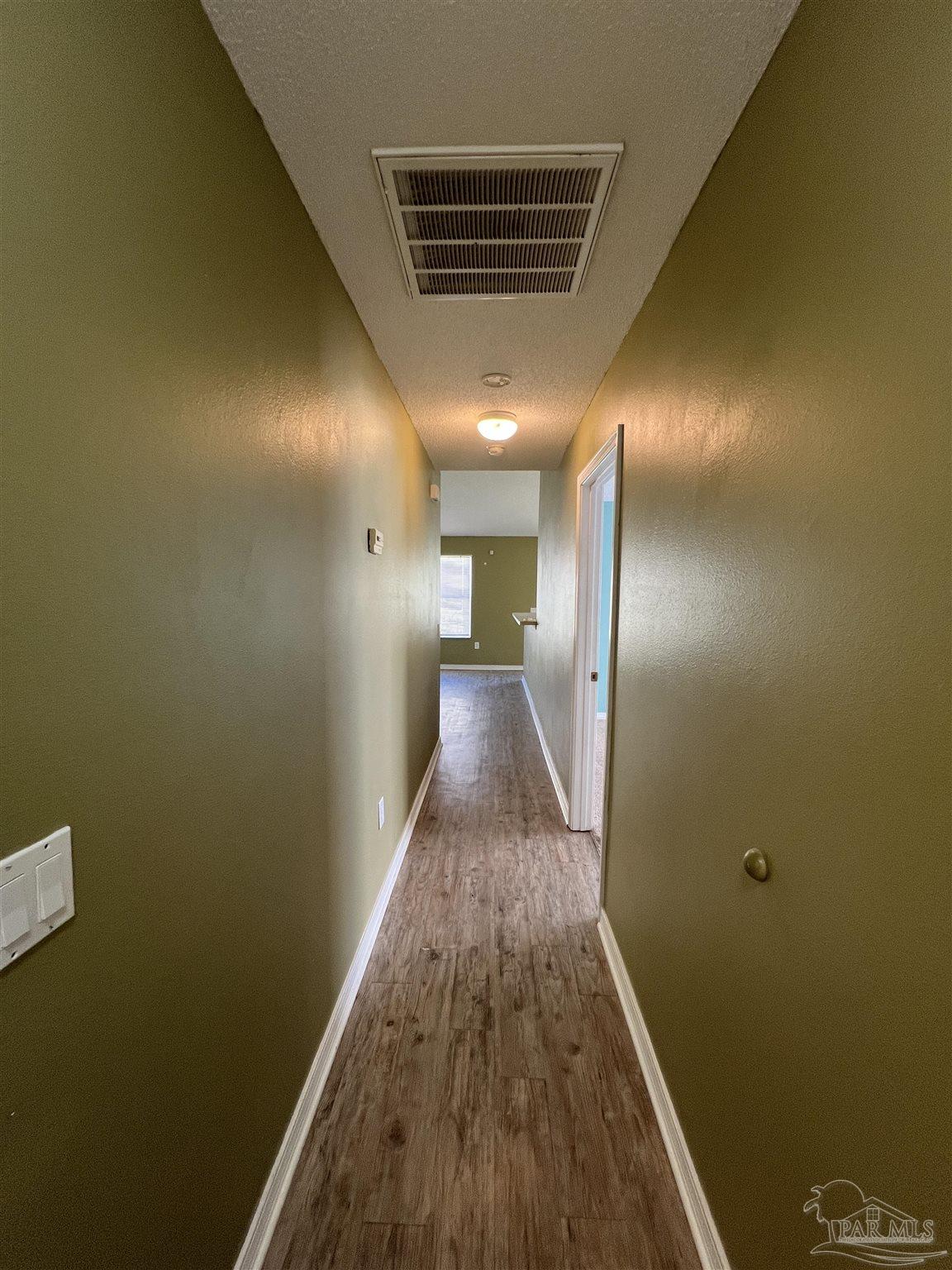 120 Nivana Drive Crestview, FL 32536 - Photo 6 of 20 a view of hallway with wooden floor