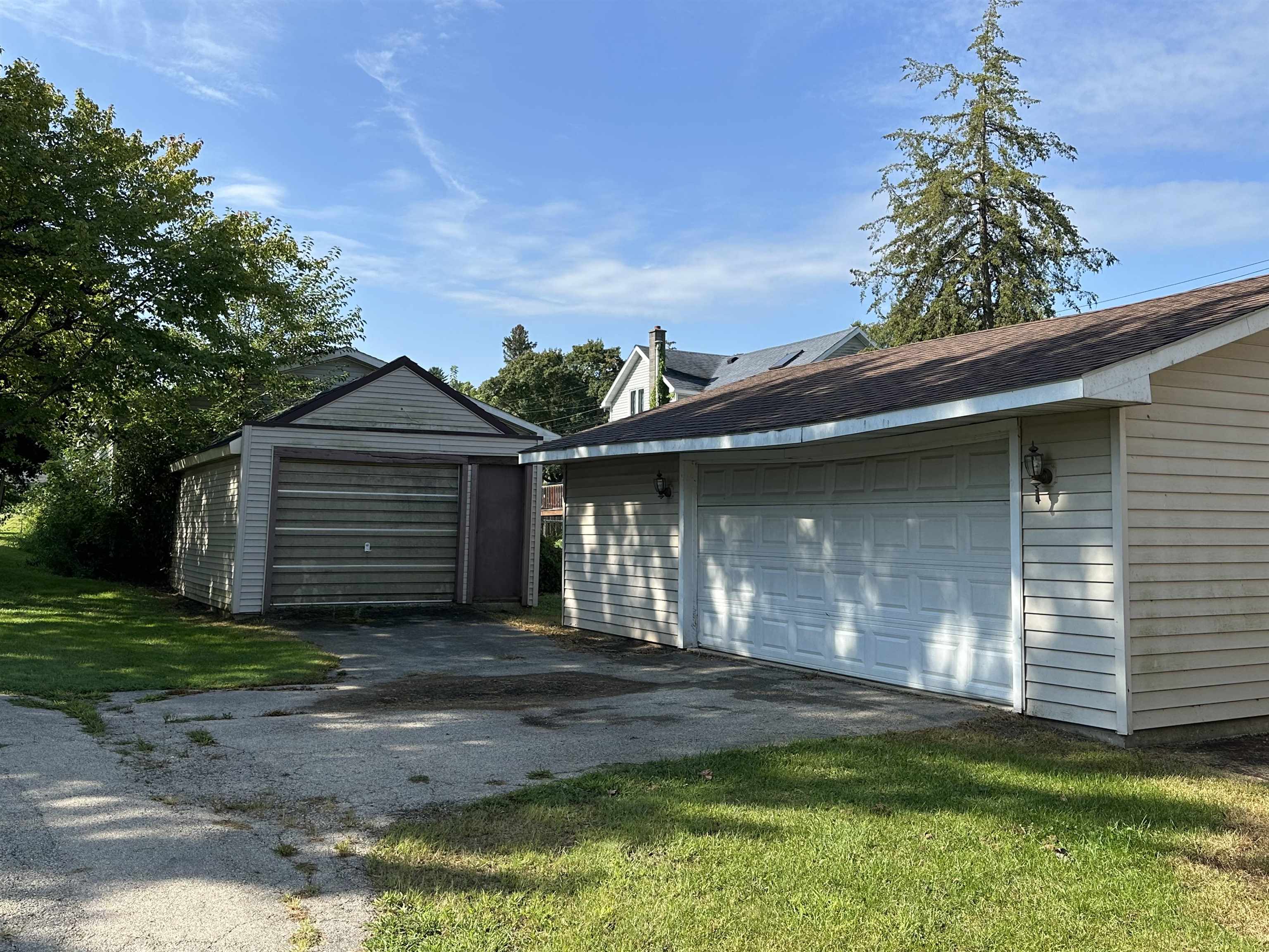 1407 Hawthorne Avenue Savanna, IL 61074 - Photo 4 of 20 a front view of a house with a yard and garage