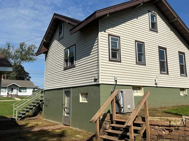 a front view of a house with a garage
