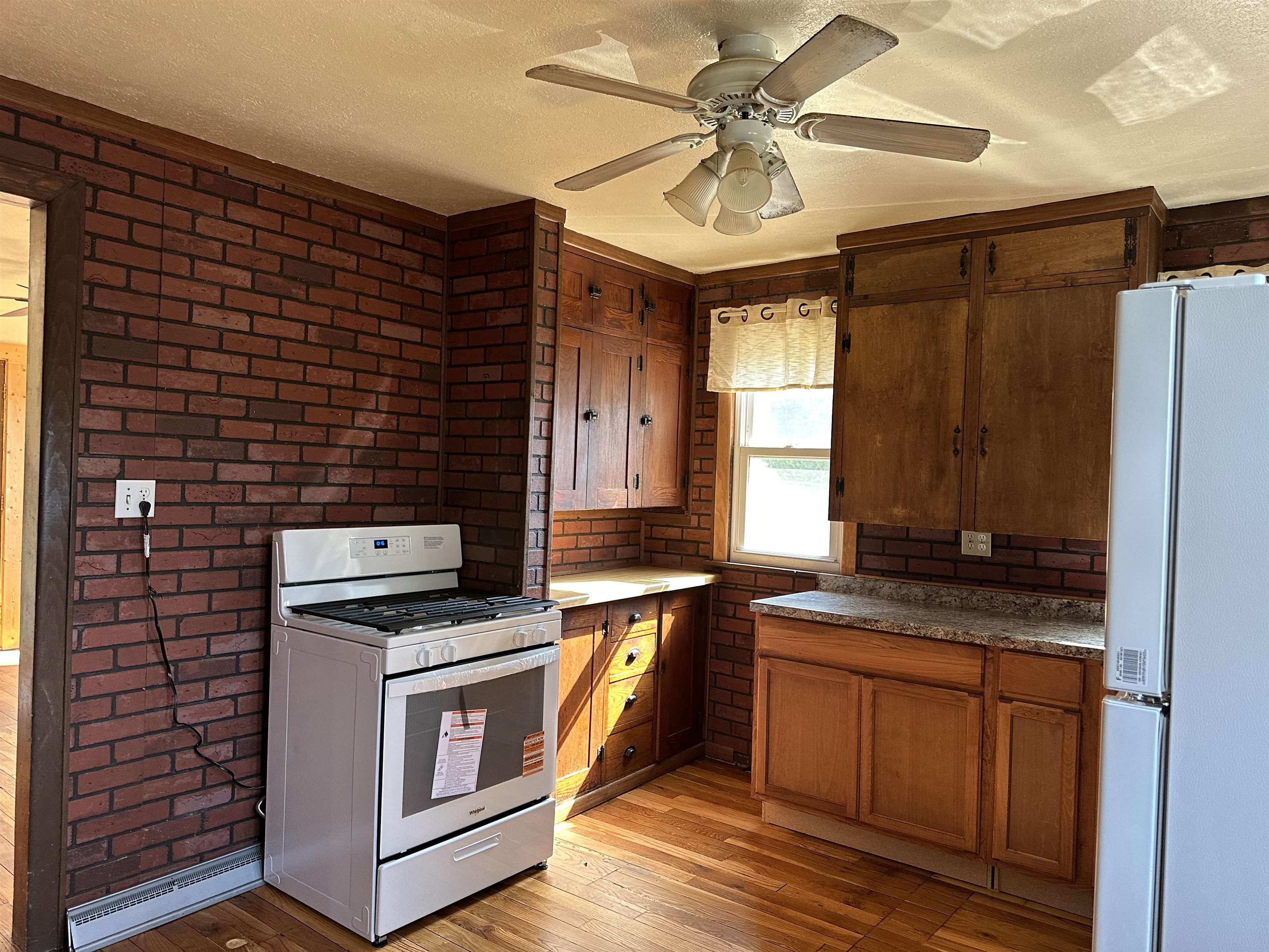 1407 Hawthorne Avenue Savanna, IL 61074 - Photo 9 of 20 a kitchen with stainless steel appliances granite countertop a stove a sink and a microwave