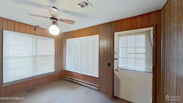 a view of an empty room and a window