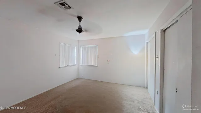 a view of empty room with windows