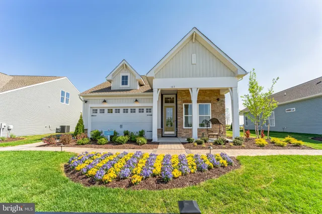 a front view of the house with outdoor space