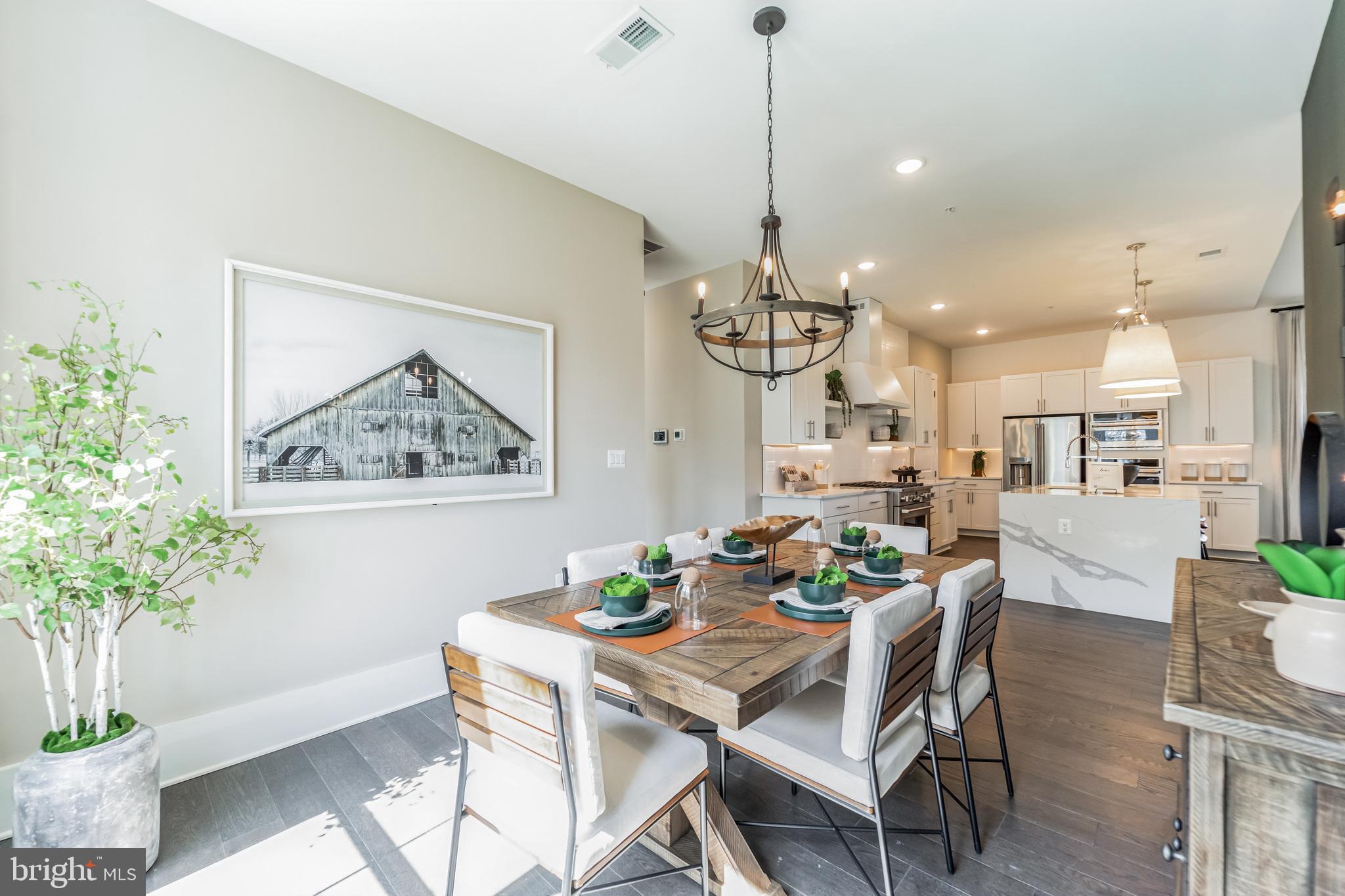 127 Flycatcher Way Stevensville, MD 21666 - Photo 14 of 49 a view of a dining room with furniture and chandelier