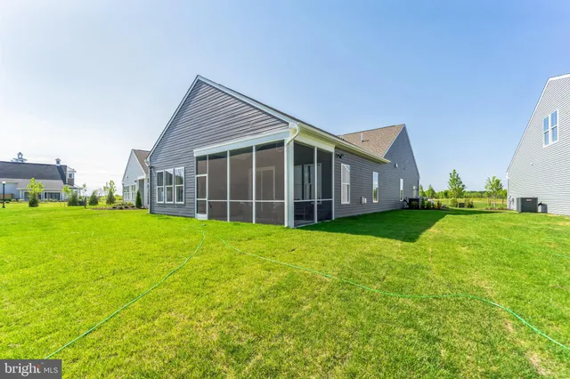 a view of an house with backyard space and garden