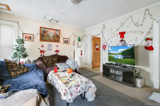 a bedroom with furniture and a flat screen tv