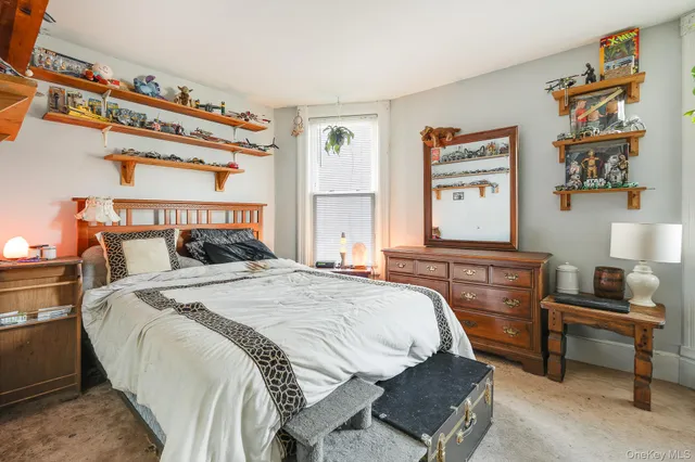 a bedroom with bed and a window