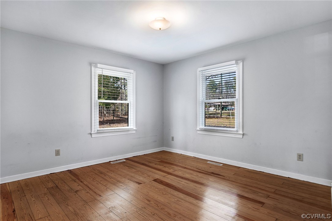 10111 Cattail Road Chesterfield, VA 23838 - Photo 18 of 31 a view of empty room with wooden floor and fan