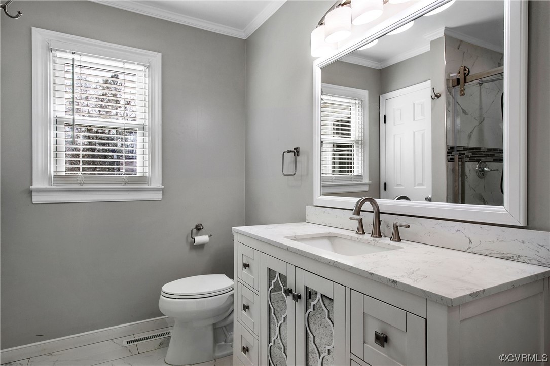 10111 Cattail Road Chesterfield, VA 23838 - Photo 20 of 31 a bathroom with a sink a toilet and a mirror
