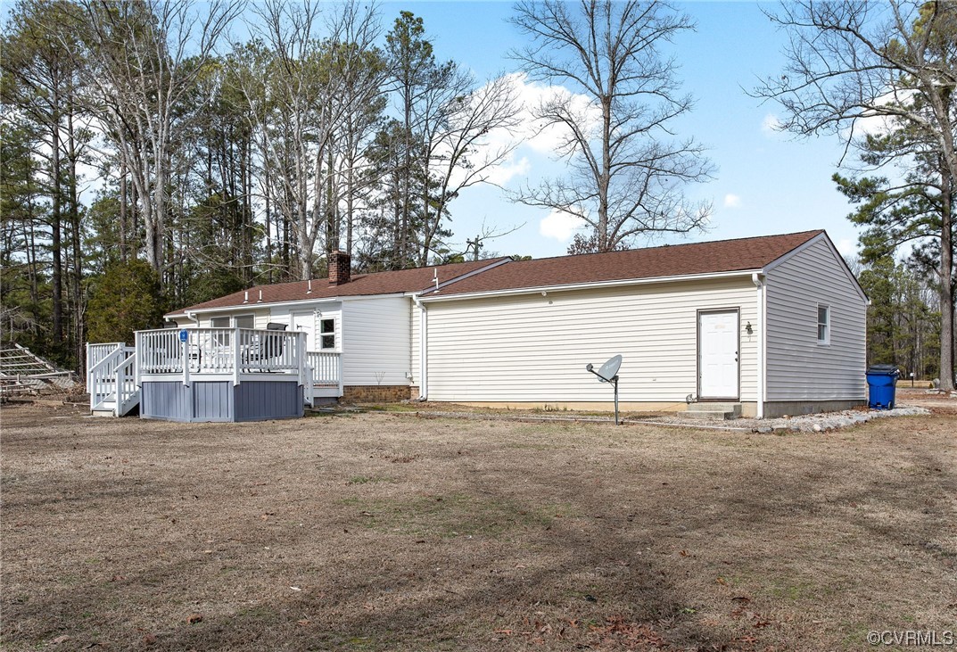 10111 Cattail Road Chesterfield, VA 23838 - Photo 30 of 31 a view of a house with a yard and garage