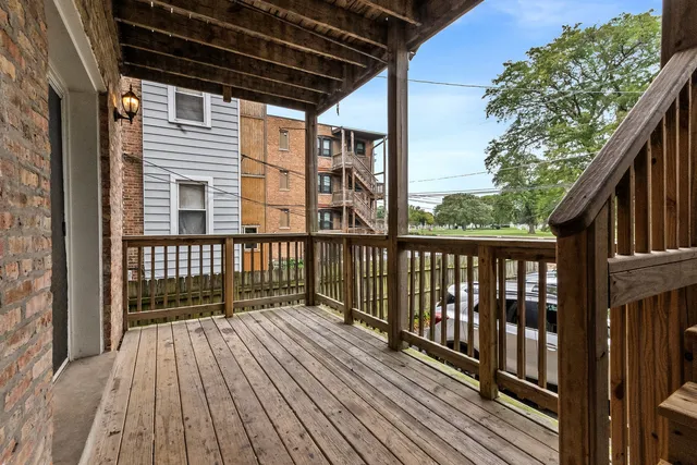 a view of wooden balcony with wooden floor