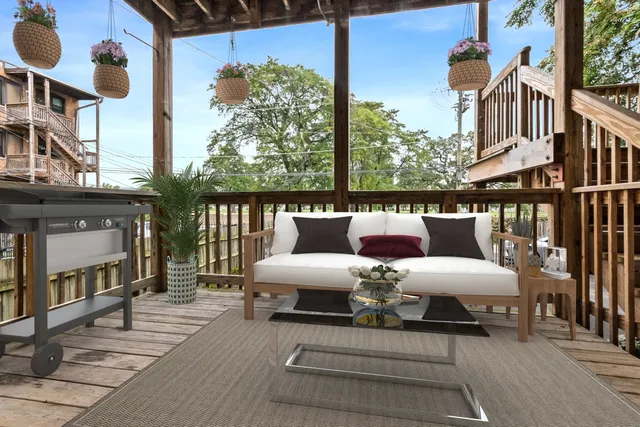 a view of balcony with furniture