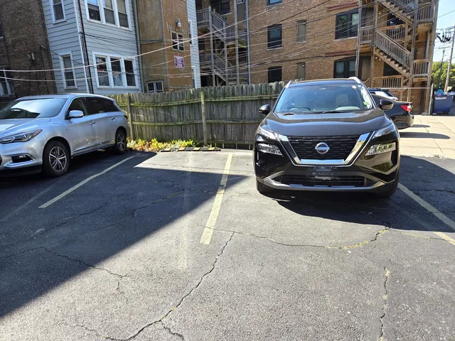a front view of a house with parking space