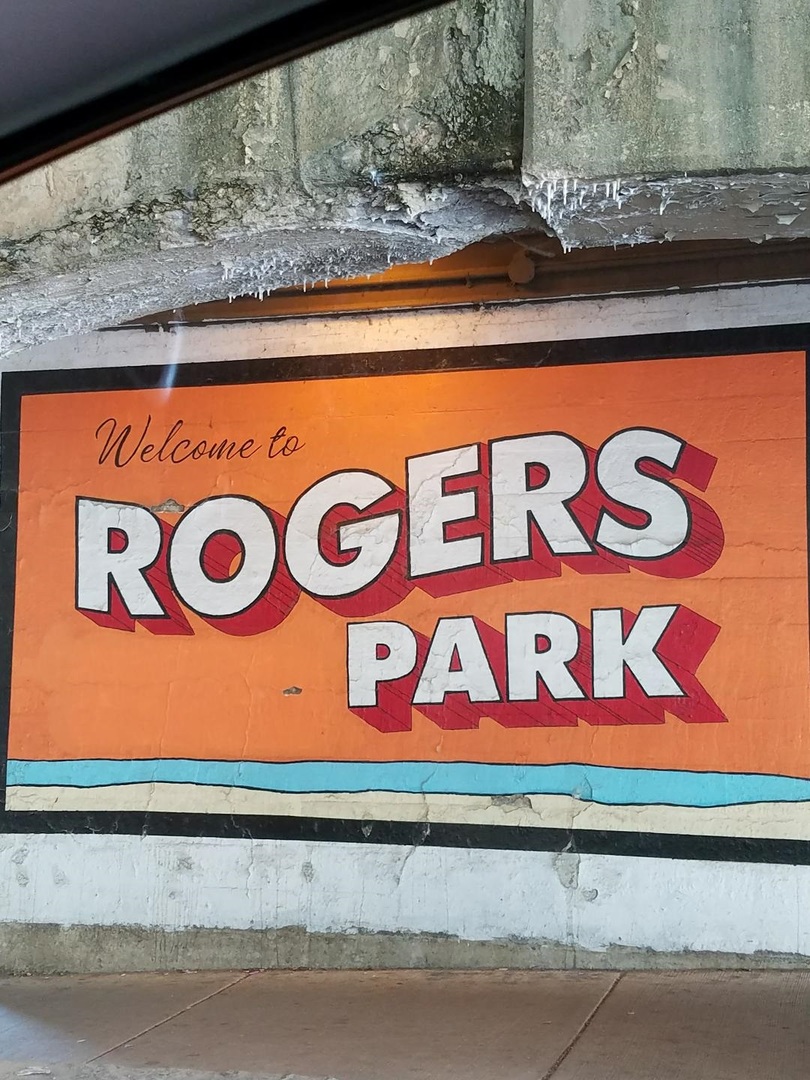 1628 West Juneway Terrace, Unit 1 Chicago, IL 60626 - Photo 49 of 49 a street sign on a window