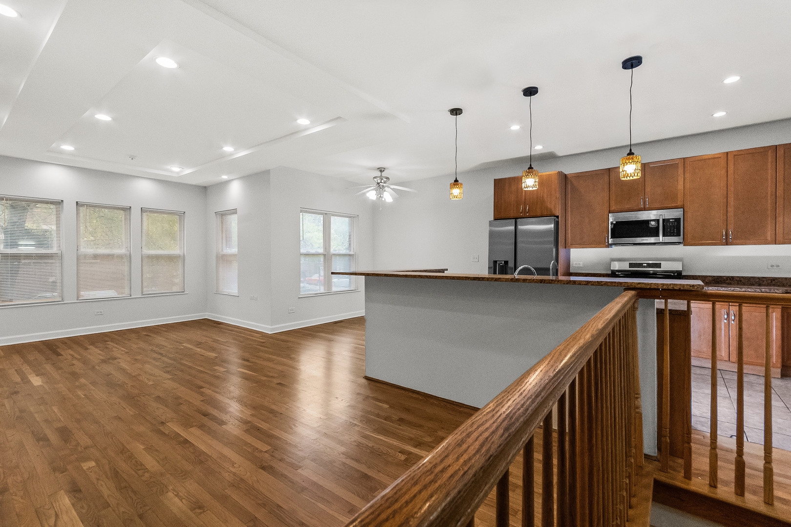 1628 West Juneway Terrace, Unit 1 Chicago, IL 60626 - Photo 9 of 49 a kitchen with stainless steel appliances granite countertop a stove a sink and a refrigerator