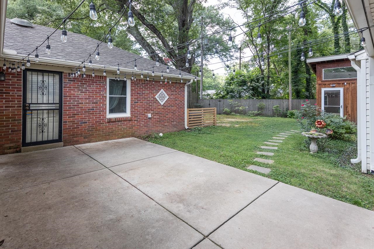 4696 Kaye Road Memphis, TN 38117 - Photo 34 of 39 a front view of a house with garden