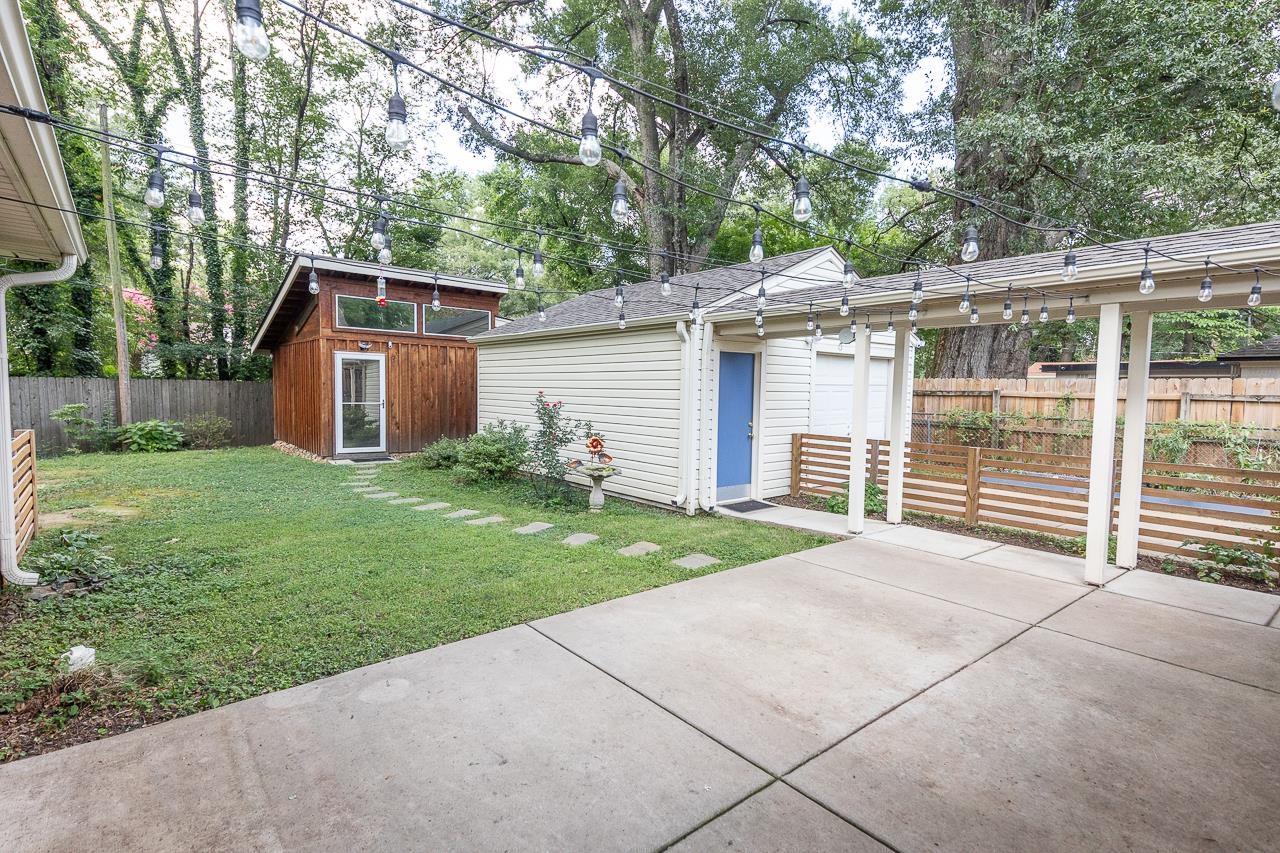 4696 Kaye Road Memphis, TN 38117 - Photo 36 of 39 a view of a house with a yard and large tree