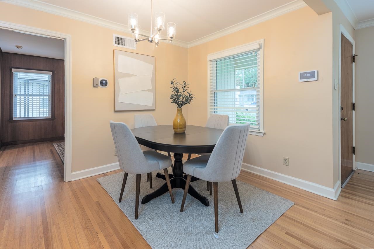 4696 Kaye Road Memphis, TN 38117 - Photo 8 of 39 a view of a dining room with furniture window and wooden floor