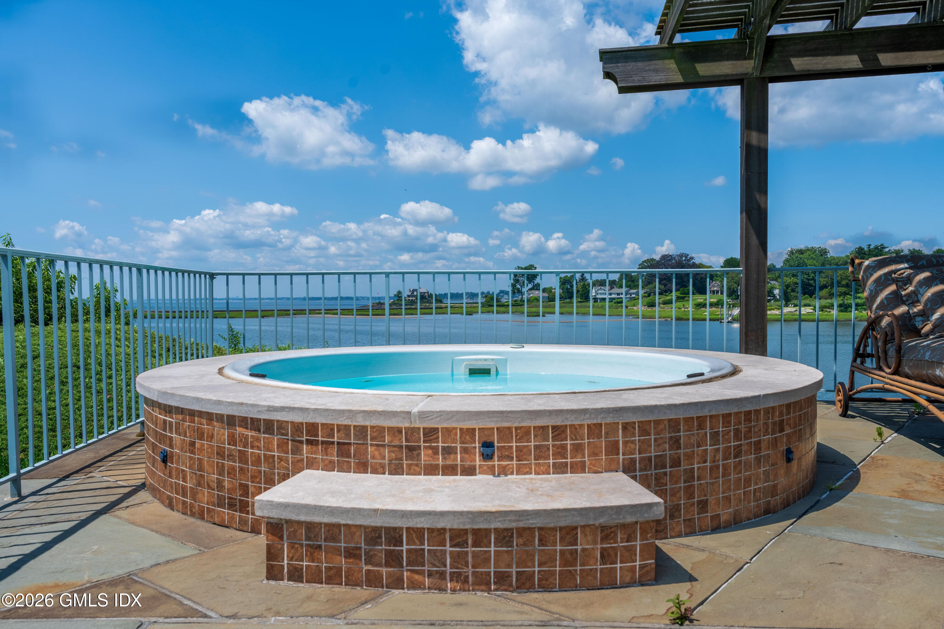 108 Cedar Cliff Road Riverside, CT 06878 - Photo 18 of 49 a view of a swimming pool with couches in patio